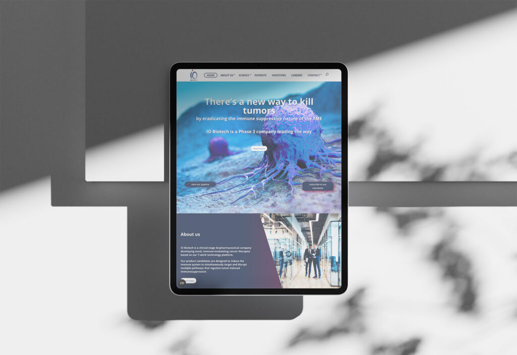 io biotech homepage mockup showing cancer tumor cells on a portrait standing upright ipad